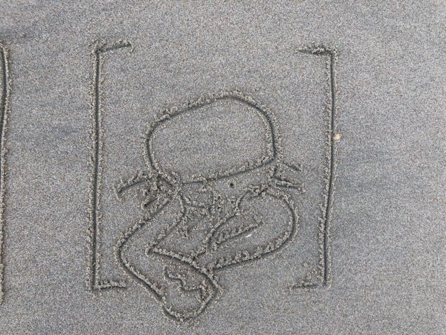 dessins éphémères sur le sable mouillé à marée basse
